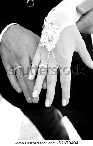 Hand of the groom and the bride