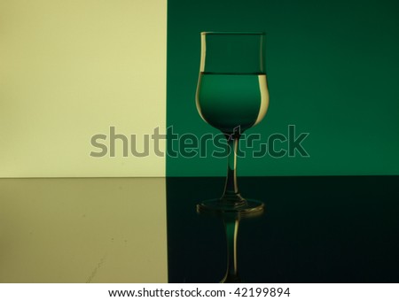Wine Glass on the green and yellow background