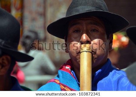 ORURO, BOLIVIA - FEB 16: man with traditional flute at Oruro Carnival in Bolivia, declared UNESCO Cultural World Heritage. February 16, 2012 in Oruro, Bolivia