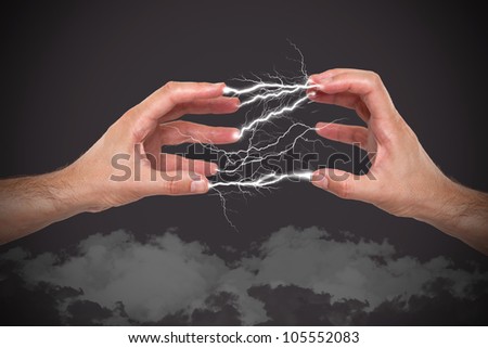 Hands with lightning in the fingers