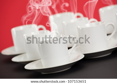 Espresso cups with steaming hot coffee
