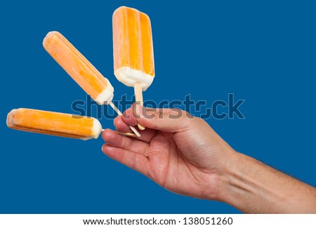 Hand holding ice cream bars