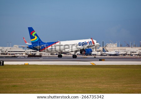 FORT LAUDERDALE, USA - April 5, 2015: A Spirit Airlines Airbus A320 landing at the Ft. Lauderdale/Hollywood International Airport, FL. Spirit Airlines has its operating base in Fort Lauderdale.