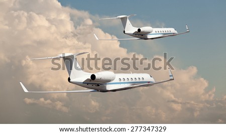 Two private jets flying side by side