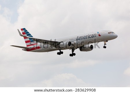 MIAMI, USA - JUNE 2, 2015: Boeing 757 American Airline approaching the Miami International Airport. American Airline is one of the oldest american airlines and one of the biggest in the world.