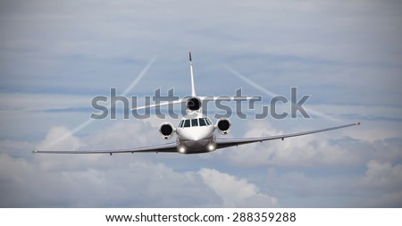 Frontal view of a private jet in midair