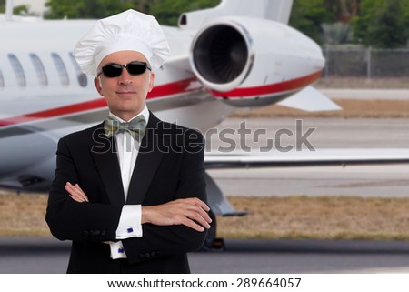 Elegant chef posing in front of a private jet