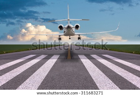 Rear view of a private jet landing