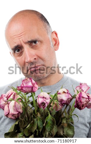 http://image.shutterstock.com/display_pic_with_logo/458665/458665,1297712633,8/stock-photo-sad-man-holding-dead-flowers-71180917.jpg