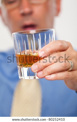 Close up of a drink being held by a man