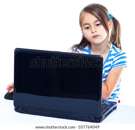 Cute little girl is sitting with her laptop Cute little girl is sitting with her laptop