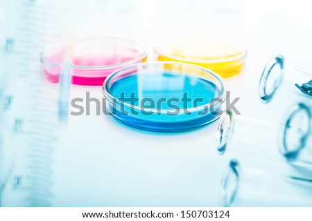 color liquid in glass petri dishes in scientific lab .medical glassware