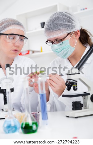 Team of scientists in a laboratory working on chemical testing.