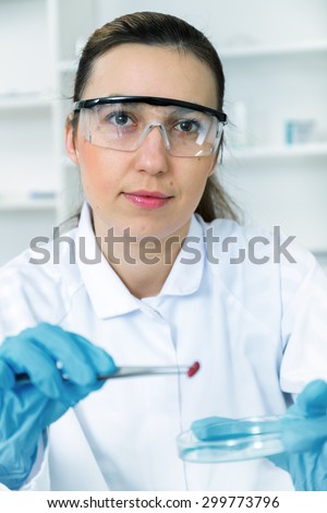 woman laboratory assistant in the laboratory of food quality.