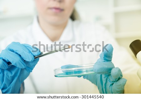 woman laboratory assistant in the laboratory of food quality