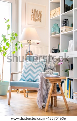 Cozy reading corner with armchair.