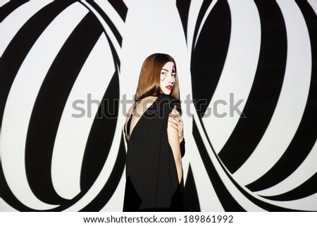 Fashion girl on black and white geometric background