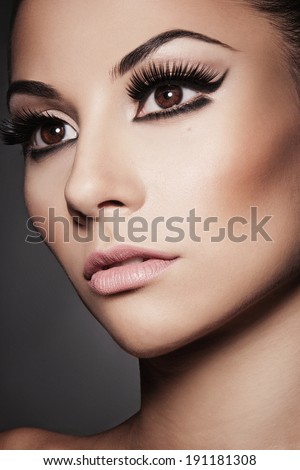 Closeup portrait of young beautiful  woman with long  eyelashes