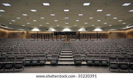 An empty lecture hall with a large amount of seats