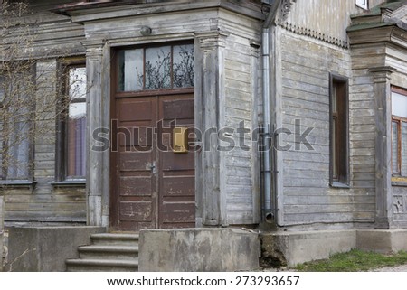 Old wooden house door with mailbox in Talsi, Latvia
