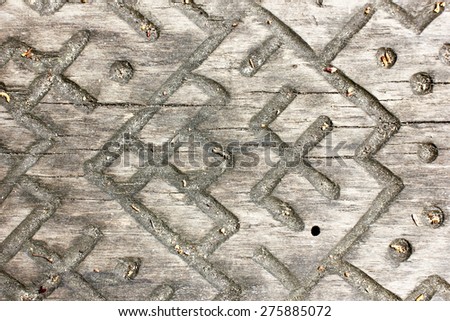Ancient Latvian signs and symbols carved in rough wood. City of Dubulti, Latvia (Europe).