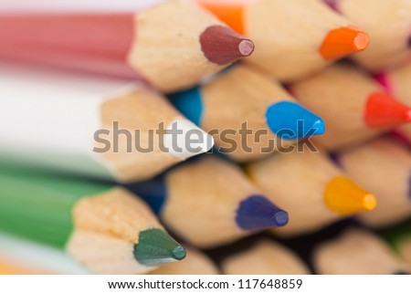Macro background of the pencil as an element for design. Colored pencils closeup