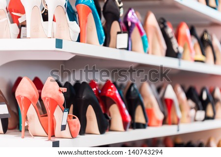Background With Shoes On Shelves Of Shop