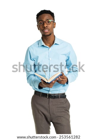 Happy african american college student standing with book in his hands on white background