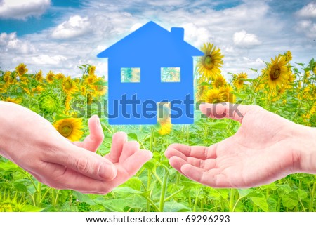 From hand to hand the house as a symbol of real estate business.