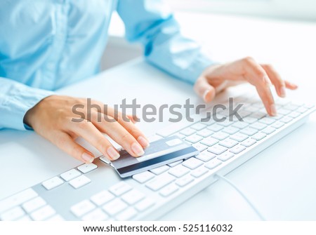Hands using computer and credit card. Online shopping