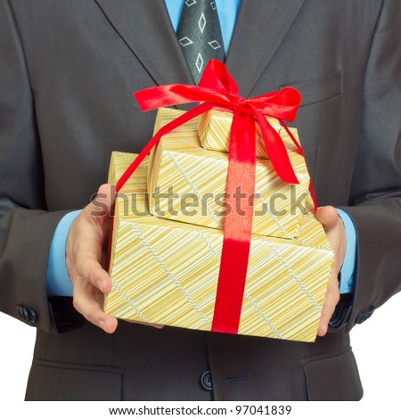 Businessman present gift box with red ribbon bow, front view (focus on the gift box)