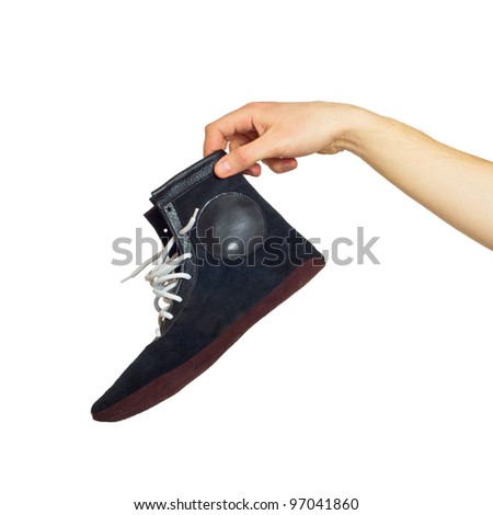 Boxing shoes in hand. Isolated on white background