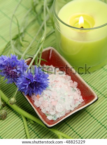Green candle and salt