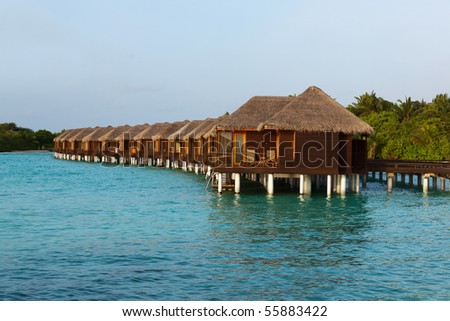 Water Villas in the sunset. Welcome to the Paradise! Maldives. High Contrast.