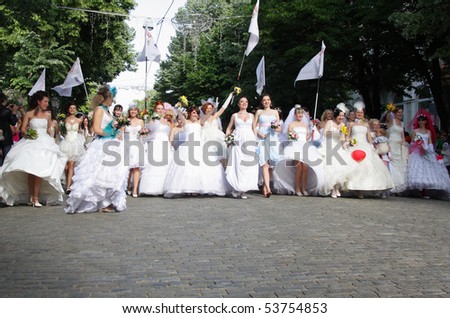 ODESSA, UKRAINE - MAY  23 : group of happy excited brides at Parade of Brides.The annual  event takes place in many Ukrainian cities. May 23, 2010 Odessa,Ukraine.