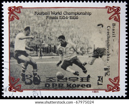 NORTH KOREA - CIRCA 1985:A post stamp printed in North Korea shows football players, devoted football world championship, series, circa 1985.