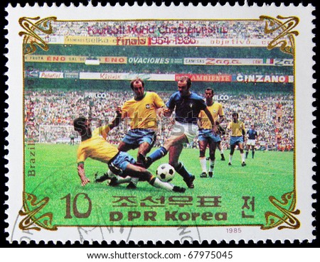 NORTH KOREA - CIRCA 1985:  A post stamp printed in North Korea, shows football players, devoted football world championship, series, circa 1985.