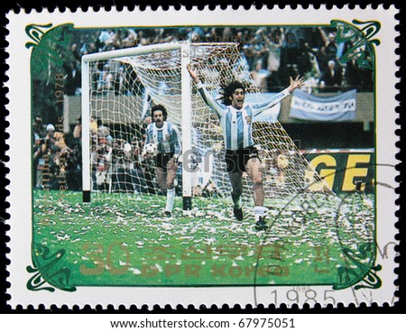 NORTH KOREA - CIRCA 1985:  A post stamp printed in North Korea, shows football players, devoted football world championship, series, circa 1985.