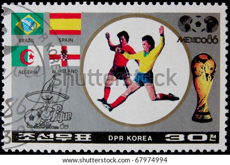 NORTH KOREA - CIRCA 1986:A post stamp printed in North Korea, shows football players, devoted Football World Cup Championship, Mexico City, series. circa 1986.
