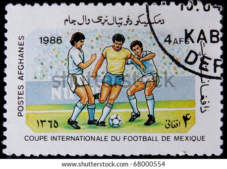 AFGHANISTAN - CIRCA 1986: A post stamp printed in Afghanistan shows football players, devoted Football World Cup Championship, Mexico City, series. circa 1986.