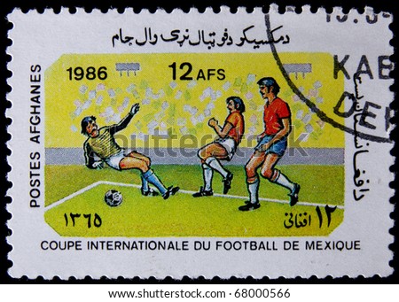 AFGHANISTAN - CIRCA 1986: A post stamp printed in Afghanistan shows football players, devoted Football World Cup Championship, Mexico City, series. circa 1986.