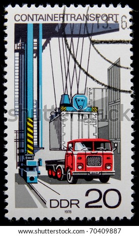 GERMANY- CIRCA 1978: A post stamp printed in Germany, shows Loading container on flatbed truck, circa 1978.