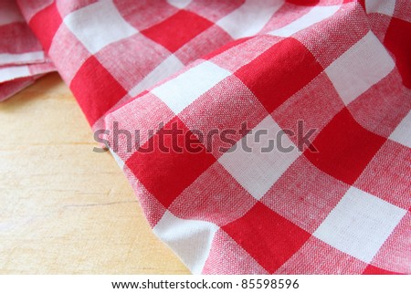 red white towel on wooden table