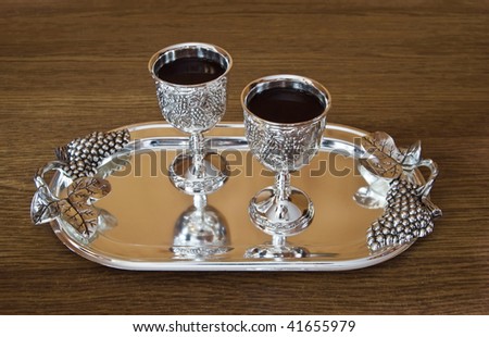 glass and tray are on a forest table