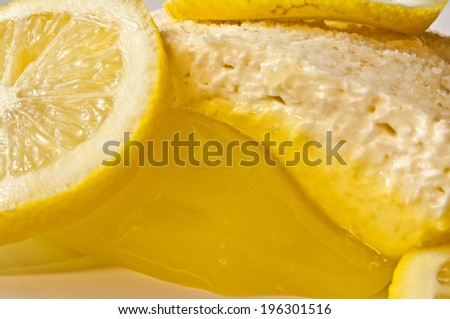 lemon square dessert with cheese topping and lemon slices
