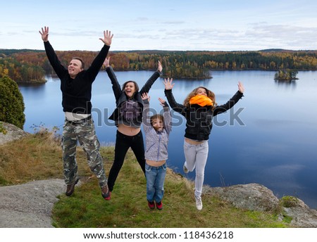 Family feel freedom in autumn scenery
