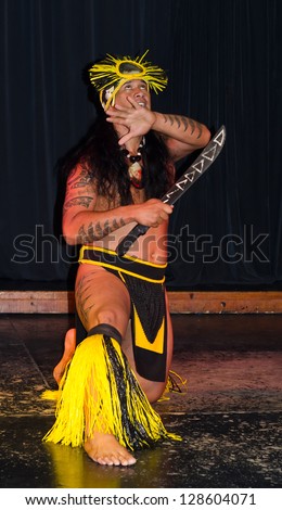 LANZAROTE, CANARY ISLANDS - MARCH 23: Cultural performance of Hawaiian traditional dressed warrior on Barcelo hotel stage on March 23, 2012 on Lanzarote - Canary Islands.