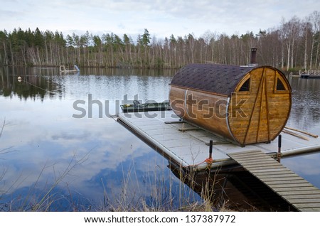 Sauna house on a lake bridge