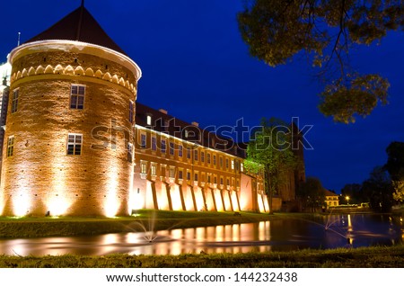 LIDZBARK WARMINSKI CASTLE, POLAND-MAY 23: Modern Krasicki hotel in medieval castle - night view in May 23, 2012 in Poland. Four stars hotel made in XV century castle can accommodate up to 250 guests,