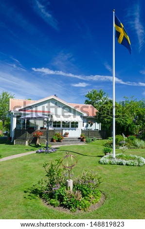 HANO ISLAND, SWEDEN - JUNE 06: Typical local villa house in Juni 06, 2013 on Hano island, Sweden. Hano is tourist attractive small island in Southern Sweden without car traffic, population 33 residents.